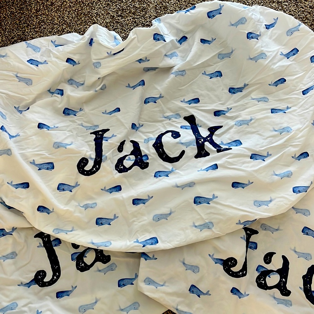 Caden Lane nautical personalized crib sheets with the name JACK in navy blue